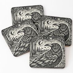 four coasters with black and white images of birds in the night sky on them