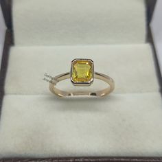 Band : Goldsmith Jewellers Material : 14K Yellow Gold Gemstone : Natural Yellow Sapphire Yellow Sapphire Stone Weight : 1.50 Carat Yellow Sapphire Stone Size : 5.85 x 6.60 mm Gross Weight : 2.550 gm Stone Shape : Emerald  Band Color : Yellow Gold Ring Size : All Size Available Made to Order Please Give Your Opinion or Feedback About The Product Note  : This Ring You can be Put All Stones of Your Choice. https://www.etsy.com/in-en/your/shops/GoldsmithJewellers/onboarding/listings/create Classic Yellow Gold Topaz Promise Ring, Fine Jewelry 14k Gold Yellow Diamond Ring, Yellow Topaz Promise Ring In 14k Gold, Dainty Emerald Cut Gold Rings, Dainty Gold Emerald Cut Ring, 14k White Gold Hallmarked Topaz Ring, Hallmarked 14k White Gold Topaz Ring, Elegant Yellow 14k Gold Birthstone Ring, 14k Gold Yellow Sapphire Ring Gift