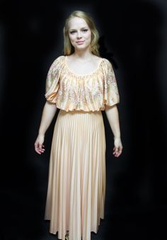 "70s J C Penney Fashion Gown, Empire Waist Long Dress,  polyester long dress, maxi dress, granny gown, peasant dress, long pleated skirt Pretty in pastel peach, this empire waisted print top/ solid bottom gown is made by J C Penney Fashion. Size 8, the washing instructions say Dry Clean Only, but I guess perhaps this was early in the days of polyester - or so this fabric feels to me like poly. I could be wrong.  The attached flowing lightly pleated skirt has a few stains (no effort has been made Spring Evening Maxi Dress With Full Skirt, Spring Dresses With Accordion Pleats, Spring Dresses With Accordion Pleats And Long Skirt, Spring Flowy Maxi Dress With Full Skirt, Vintage Full Skirt Dress With Ruffles, Vintage Dresses With Flowy Skirt, Spring Vintage Long Dress, Spring Pleated Maxi Dress With Empire Waist, Spring Pleated Empire Waist Maxi Dress