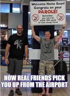 two men standing next to each other holding up a sign that says, welcome home search for your parrot how real friends pick you up from the airport