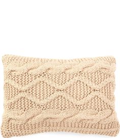 a knitted pillow on a white background