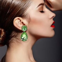 Introducing our exquisite Champagne Pear Shape Drop Earrings, surrounded by matching pave stones—a must-have addition for any sophisticated wardrobe.  Crafted for elegance and comfort, these earrings feature cPeridot-colored pear-shaped drops adorned with sparkling pave stones. Their lightweight design ensures they are easy to wear while making a sparkling statement as you enter any room. Perfect for dressing up any outfit, these earrings add a touch of glamour and sophistication to your ensembl Nadia Ferreira, Green Statement Earrings, Sophisticated Wardrobe, June Birthstone Jewelry, Zodiac Jewelry, Gifts For New Mums, Pearl Jewellery Earrings, Jewelry Ring Box, Men's Jewelry Rings