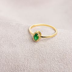 Emerald, which is considered to be the stone of love, sensitivity and loyalty, is seen as a symbol of harmony in relationships. Our oval emerald and diamond ring is both stylish and suitable for daily use. Bring a smile to your loved ones' faces by gifting them on their birthday, graduation day, wedding anniversaries and many more special occasions.   Emerald is the birthstone of May. Our necklace compatible with our ring: https://queenjewelryturkey.etsy.com/listing/1391092889/oval-cut-real-diam Elegant Formal Ring With May Birthstone, Formal 14k Gold Emerald Ring With Halo, Elegant Formal Birthstone Diamond Ring, Elegant Formal Diamond Ring With Birthstone, Elegant Formal May Birthstone Ring, Elegant Emerald Cubic Zirconia Ring With Halo, Elegant Emerald Ring With Halo In Cubic Zirconia, Elegant Emerald Halo Ring With Cubic Zirconia, Elegant Round Cut Emerald Birthstone Ring