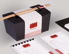 the stationery is designed to look like it has chopsticks sticking out of it