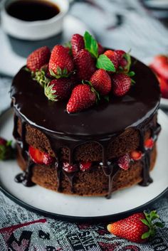 a chocolate cake with strawberries on top