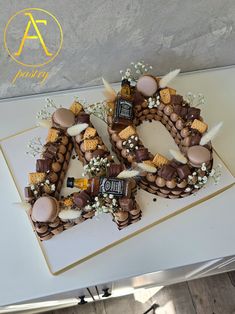 a cake made to look like the number 50 with chocolates and marshmallows