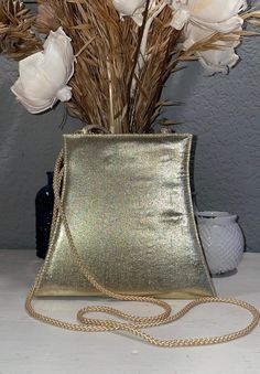 "I am the only prior owner of this little purse, I believe I used it for a wedding, then stored it away.  The purse has an option for a double strap carrying handle or a crossbody strap, neither are removable though.  It does have a little pocket inside, snaps shut on the top.  It's either late 80's or early 90's, lovely condition.   The crossbody strap has a 22\" drop - see photos for measurements of the purse itself." Vintage Rectangular Party Bag, Vintage Rectangular Evening Bag For Party, Gold Satchel Bag For Party, Vintage Handheld Bag For Party, Vintage Clutch Shoulder Bag For Party, Party Clutch Shoulder Bag With Adjustable Strap, Party Evening Shoulder Bag With Adjustable Strap, Chic Gold Evening Bag With Adjustable Strap, Adjustable Strap Shoulder Evening Bag For Party