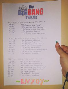 the big bang theory sheet is being held up by someone's hand with writing on it