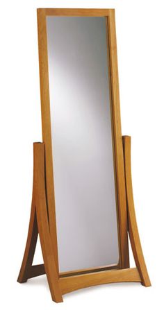 a wooden floor mirror with a stand on it's sides and a white background