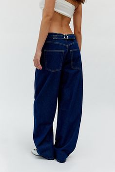 Updated essential BDG Logan barrel jean with a twisted side seam along the baggy barrel leg. Find them only at Urban Outfitters. Features BDG Logan Twisted Buckle barrel jeans Baggy jean Rigid denim that softens over time Slouchy mid-rise with an adjustable back buckle Baggy subtle barrel leg with a twisted side seam 5-pocket style; zip fly UO exclusive Content + Care 100% Cotton Machine wash Imported Size + Fit Adjustable rise. Use the buckles to wear them as slouchy low rise, mid rise or high Baggy Fit Jeans, Barrel Jeans, Baggy Jean, Buckle Jeans, Fashion 2024, Baggy Jeans, Baggy Fits, Fit Jeans, Jeans Fit