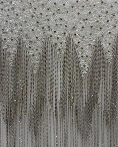 Details: Crystal Color: Silver Sequin Color: White Base Color: White Crystal Material: 100% Glass Fabric Width: 120cm Fabric Length: 2.35 meters This fabric is in stock and ready to ship from Paris, France. Discover the elegance of our Luxurious Silver Crystal Fringe Beaded Net Fabric. This high-end embroidery fabric, adorned with 100% glass crystals, is perfect for creating stunning evening gowns, bridal wear, and sophisticated accessories. Hand-embroidered for exceptional quality, it's the ide Crystal Lattice, Crystal Fringe, Mesh Fashion, Beading Netting, Silver Embroidery, Luxury Fabric, Bridal Fabric, Net Fabric, Embroidery Fabric