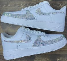 The famous Nike Air Force 1 but add a little bit of spice! These beautiful sneakers are blinged out on the Nike swooshes as well as the outside toe box. Rhinestones are hand placed on both the insides and outsides of the shoes *Depending on what color you choose for the rhinestones, shoes may be painted with high quality leather paint underneath the rhinestones to match * Many different sizes to choose from * Made to order * Sizes are in womens *Authentic Nikes bought from Nike store *Tested and Quinceanera Shoes, Swarovski Nike, Event Shoes, Bedazzled Shoes, Custom Air Force 1, Bling Shoes, Rhinestone Shoes, Cute Nike Shoes, Sneakers Athletic