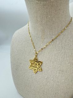 This Shema Israel Star of David 18K Gold-Plated Pendant Necklace is a unisex treasure that bridges faith and fashion with grace and strength. Crafted to resonate with the profound Shema Israel prayer, the pendant carries the initials שמ"ע ישראל ה' אלוהינו ה' אחד, embodying the central tenet of Jewish faith — the oneness of God. Its timeless design and spiritual significance make it a versatile piece suitable for all genders and ages. Features: Materials: 18K Gold-Plated Brass Pendant Diameter: 1 Gold Star Of David Necklaces, Spiritual Yellow Gold Star Of David Necklace, Luxury Blue Star Of David Necklace, Gold Star Of David Amulet Necklace, 14k Gold Star Of David Necklace, Tarnish Resistant, Star Of David, Brass Pendant, Gold Pendant Necklace, Earring Necklace