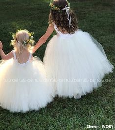 "Sweet simplicity! Our unique full and fluffy tulle dress feature a lined satin sleeveless bodice with a tutu style skirt. The back of the dress bodice is stretchy for a custom, yet versatile, comfort fit. Select from the dropdown if you would like an IVORY dress (as shown in the second image), or a SOLID WHITE or SOLID OFF-WHITE/ LIGHT IVORY (as shown in the first image). We can change these colors! WANT A SEWN IN SLIP TO LINE THE TUTU? https://www.etsy.com/listing/125566641/add-a-slip-to-the-t Flower Girl Dresses White, Ivory Tulle Skirt, Flower Girl Dresses Navy, Champagne Flower Girl, Flower Girl Dresses Champagne, Champagne Flowers, Tulle Flower Girl Dress, Ivory Skirt, Fluffy Skirt