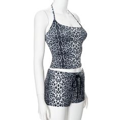 This Leopard Print Summer Two-Piece Set includes a Crop Top and Shorts made from a high-quality blend of synthetic fibers for a sleek and stylish look. The top features a slim fit with spaghetti straps and a halter neckline, while the shorts have a low waist and ankle-length style. Crafted using advanced weaving techniques, this set is perfect for summer occasions and is available in sizes S, M, and L. The fabric content is 91% to 95% synthetic fiber, providing medium stretch and durability. Pai Sleek Hairstyle, Chic Streetwear, Summer Spaghetti, Crop Top And Shorts, Sleek Hairstyles, Sleeveless Crop Top, Halter Neckline, Low Waist, Weaving Techniques