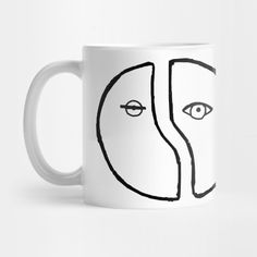 a coffee mug with two faces drawn on it