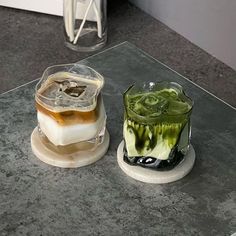 there are two different desserts on the counter top, one is green and white