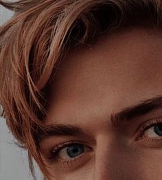 a close up of a person with blue eyes