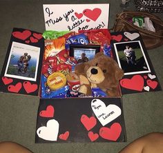 a teddy bear sitting on top of a table next to some pictures and other items