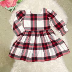 "Red white black plaid very soft made of 100% cotton. The top of the dress is lined, buttons in the back. All seams are professionally serged.  The listing is for the dress only, the bow can be purchased separately also the matching suspenders and bow tie, the listing can be found in our shop or just send us a message and I'll send  a link to purchase.  Dress is about knee length. Fits true to size   Proudly made in the USA  Machine wash cold inside out, gentle cycle. Lay flat or hang to dry. size chart:  size/chest/length 0-3m/16\"/13.5\" 3-6m/17\"/15.5\" 6-12m/18\"/17.5\" 12-18m/18.5\"/18.5\" 18-24m/20\"/19.5\" 2t/21\"/20.5\" 3t/22.5\"/22\" 4t/23.5/23\" 5y/24.5\"/24.5\" 6y/25\"/25.5\" 7y/26.5\"/26\" 8y/27.5\"/27\" 9-10y/28.5\"/29.5\" Please note: Due to variation in each computer monitor Cute Long Sleeve Holiday Dress, Winter Holiday Cotton Dress, Plaid Christmas Holiday Dress, Cotton Holiday Dress For Fall, Cotton Holiday Dresses For Fall, Fall Holiday Cotton Dresses, Cute Red Long Sleeve Holiday Dress, Plaid Dress For Christmas Holiday, Plaid Dresses For Fall Holiday