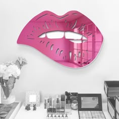 a mirror that is on the wall above a desk