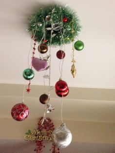 a christmas tree with ornaments hanging from it