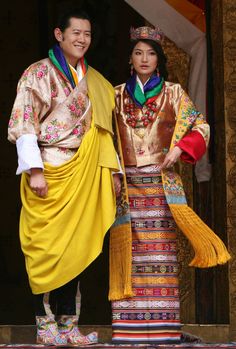 a man and woman dressed in traditional chinese clothing