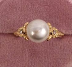 Stunning Vintage Gold Filled Dress Ring ring size L  - the inside diameter of the ring band  is 1.58 cm across (this is a small ring size) The beautiful Pearl is 8.5 mm wide  and the complete setting sits 1 cm high Stamped S925. Total weight is 2.47 grams note: the inner band of the ring is silver please see photos A stunning Ring, in excellent condition (Box for display purposes only) Classic Wedding Style Bridal Dress Jewelry Roseworthysvintage Customs and import taxes Buyers are responsible f Antique Pearl Ring, Vintage Open Flower Ring For Wedding, Vintage Style Oval Flower Ring For Formal Occasions, Vintage Oval Flower Ring For Formal Occasions, Vintage Flower Ring For Formal Occasion, Formal Vintage Flower Ring, Vintage Hallmarked Flower Ring For Formal Occasions, Vintage Yellow Gold Flower Ring For Formal Occasions, Vintage Pearl Open Ring For Anniversary