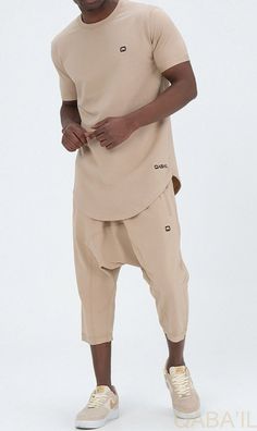 QL Relaxed Fit Nautik Set in Beige Description:Enjoy the warmth of summer with a fresh new look! This T-shirt and shorts set offers comfort, functionality and style. Featuring a shirt with a round neck and a stylish round hem and a three-quarter shorts that lets you enjoy the sun while keeping covered. This holiday wardrobe is all you need to feel at your best this season. Modern Islamic clothing for men Very high-quality fabric from top brands Short sleeved T-shirt with a small logo on the left Khaki Bottoms For Leisure In Summer, Khaki Bottoms For Summer Leisure, Summer Cotton Sets With Built-in Shorts, Cotton T-shirt With Curved Hem For Summer, Summer Cotton T-shirt With Curved Hem, Casual Leisure Sets For Spring, Beige Leisure Shorts For Summer, Beige Stretch Casual Shorts, Casual Spring Leisure Sets