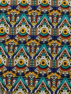 an african print fabric with geometric designs on it