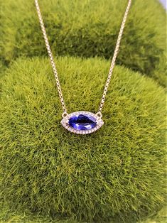 "NP378 Tanzanite-diamond necklace. 14k yellow gold east-west style necklace set with tanzanite and diamond halo. Tanzanite is deep purple color, marquise cut, 1.06cts. Diamonds are round brilliant cut .09cts in total weight. Necklace is 17\" long. Middle part measure approximately 14mx7mm." Marquise Pendant Necklace, Long Middle Part, Tanzanite Necklace, Retail Jewelry, Halo Necklace, Deep Purple Color, Tanzanite Diamond, Star Pendant Necklace, Necklace Diamond