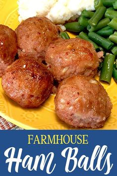 a yellow plate topped with meatballs and green beans