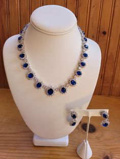 Created sapphire and diamond/zircon necklace and earring set.  5mm to 6mm sapphires and 1mm to 3mm diamond accents on necklace.  Chain is 18 inches non adjustable.  Earrings are 1.5 inches with a 1 inch drop.  4mm to 5mm sapphires and 1mm to 3mm diamond accents.  Set in stamped 925 silver. Dazzling Sapphire Jewelry For Formal Occasions, Sapphire Cubic Zirconia Jewelry For Jewelry Making, Oval Jewelry With Sparkling Stones For Formal Occasions, Sapphire Jewelry With Brilliant Cut Cubic Zirconia, Sapphire Cubic Zirconia Jewelry With Brilliant Cut, Oval Cubic Zirconia Evening Jewelry, Party Jewelry With Brilliant Cut Sapphire, Sapphire Crystal Jewelry For Anniversary, Party Sapphire Jewelry With Brilliant Cut