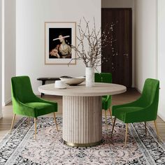 a dining room table with green chairs and a rug on the floor in front of it