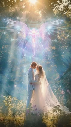 a bride and groom are standing in front of an angel's wings backdrop with the sun shining down on them