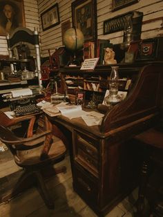 an old fashioned desk and chair in a room