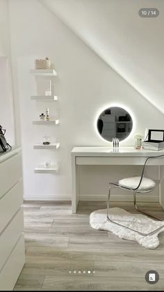 a white desk with a mirror on top of it next to a chair and shelf