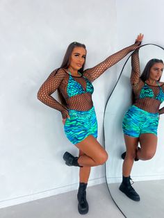 Stretchy Fishnet Crop Top, the perfect coverup for your Shimmyshine outfit! Perfect for nights out, events, holidays, raves, parties, festivals.. Fully tracked worldwide shipping Klarna, Clearpay and Laybuy available. High Quality Stretch Lycra Blend Exclusively designed and made in our UK studio Model is UK size 8-10 wears size 8. Waist 26-28, Bra size 34B, Height 5"3. All products are slim fitting due to the nature of the material. If you have any sizing questions please contact us. Hand-wash only Summer Mesh Top With Mesh Sleeves, Fishnet Mesh Top For Summer Parties, Summer Party Mesh Top With Fishnet Details, Summer Party Fishnet Mesh Top, Long Sleeve Party Cover-up For Beach Season, Blue Mesh Top With Mesh Sleeves For Summer, Summer Mesh Top For Club, Summer Blue Mesh Top With Mesh Sleeves, Stretch Long Sleeve Cover-up For Party