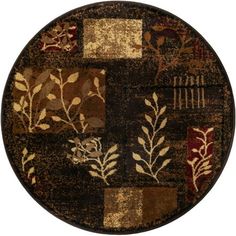 a round area rug with leaves and flowers on the center in brown, red, yellow and beige colors