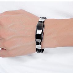 When you wear this Fashion Bracelet by Innovato Design, wear it proud because it has features that you will really love. For instance, the mosaic magnet is one feature that is modern about this piece of accessory. Made of silicone and stainless steel, this amazing fashion bracelet has a smooth, polished, and sleek surface over its clasp and metal plate. It has a silicone strap, buckle clasp, and a metal plate with a mosaic magnet. Aside from these features, you can enjoy its additional feature which is the free engraving. You can decide on what design to be engraved on the metal plate of this bracelet.  Product Highlights:   Made of stainless steel and silicone  Comes with free engraving  Bracelet perimeter: 8.27in; Metal plate length: 1.5in; Width: 0.39in; Weight: 0.81oz  Durable, tarnish Adjustable Magnetic Stainless Steel Bracelets, Adjustable Stainless Steel Magnetic Bracelets, Modern Black Stainless Steel Wristband, Modern Silver Magnetic Bracelets, Modern Silver Magnetic Bracelet, Modern Stainless Steel Bracelet With Black Band, Modern Black Magnetic Jewelry, Modern Stainless Steel Jewelry With Black Band, Modern Adjustable Stainless Steel Wristband