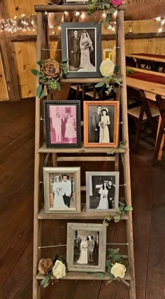 an old ladder is decorated with pictures and flowers for a rustic wedding ceremony at the barn