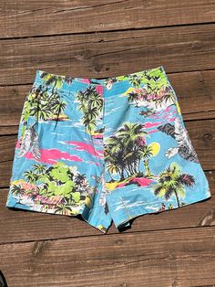 Fab pair of genuine 1980s-era high-rise shorts from Pantree, size Small (juniors 5/7).  Excellent vintage condition with no marks or holes, light fading commensurate with age.  Elastic waistband, stretches just fine, 2 side pockets.  Great aloha print in hot pink, lime green, lemon yellow, black, and white on sky blue.   Freshly laundered and line-dried for you!  Approximate garment measurements laid flat (all measurements in INCHES): waist: 14 (stretch to 17.5) inseam: 3 front rise: 14.5  back rise: 15.5 hips: 20   Please note that our shipping prices include tracking, insurance, and assume "worst-case" - i.e., to the West Coast from our East Coast shop - we refund overestimations on shipping as per our Shipping Policies.  We ship to most countries - convo us for combined or non-US shippi Vintage Bottoms For Beach Season Vacation, Vintage Summer Bottoms With Built-in Shorts, Retro Elastic Waistband Bottoms For Vacation, Retro High Waist Beach Bottoms, Retro Short Bottoms For Beach Season, Retro Short Beach Bottoms, Retro Beach Bottoms With Built-in Shorts, Retro Blue Bottoms For Beach Season, Retro Cotton Shorts For Beach Season