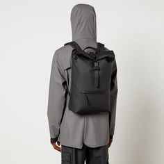 Sleek and functional, the Rain's Rolltop backpack features an all-black design with a showerproof matte shell outer and aqua seal trims for protection from the elements. The rucksack has a front zipped pocket for easy access to your everyday belongings while on the go. The spacious main compartment is perfect for fitting everything you need for a weekend away..Style Notes:.Rains Rolltop rucksack.Black matte shell.Top handle, shoulder straps, front zipped pocket.Clip front flap closure.Size & Fit:.Dimensions: H: 56cm x W: 31cm x D: 5cm Modern Waterproof Backpack For Outdoor Activities, Functional Waterproof Nylon Backpack, Functional Nylon Waterproof Backpack, Waterproof Black Bag, Urban Waterproof Backpack For Outdoor Activities, Urban Style Waterproof Backpack For Outdoor Activities, Black Waterproof Outdoor Backpack, Black Waterproof Backpack For Outdoor, Waterproof Black Travel Bag