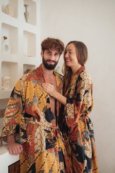 **'Citrus Blaze' SILK KIMONO ROBE FOR MEN**   Whether you're enjoying a cup of coffee on a sunlit balcony, relishing a leisurely breakfast, or unwinding in the evening, our luxury silk kimono robe transforms ordinary moments into cherished rituals. Designed by us and lovingly handcrafted by skilled artisans in Bali, Indonesia, this robe is more than just a garment--it's a reminder to embrace the present, breathe deeply, and celebrate the simple joys of life. ✨ **DESIGNED WITH PRACTICAL FEATURES* Luxury Husband, Bohemian Silk Robe With Kimono Sleeves, Luxury Silk Spring Robe, Silk Robe Floral, Mens Silk Robes Navy, Long Silk Robe, Luxury Long Floral Print Robe, Men's Kimono, Mens Robes