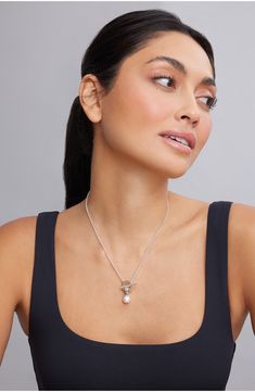 Enduring sophistication meets everyday versatility in a toggle necklace crafted with a lustrous pearl charm that can be detached for other wearing options. 16 1/2" length; 1 1/2" drop Toggle closure Pearl size: 9–9.5mm Sterling silver/freshwater cultured pearl/18k gold Imported Pearl Toggle Necklace With Toggle Clasp, Classic Pearl Charm Toggle Necklace, Classic Toggle Necklace With Pearl Charm For Gift, Elegant Pendant Toggle Necklace, Elegant Toggle Necklace With Lobster Clasp As Gift, Silver Toggle Necklace With Pearl Pendant, Silver Toggle Necklace With Pearl Charm Gift, Classic Pearl Necklace With Toggle Clasp, Elegant Lariat Charm Necklace With Lobster Clasp