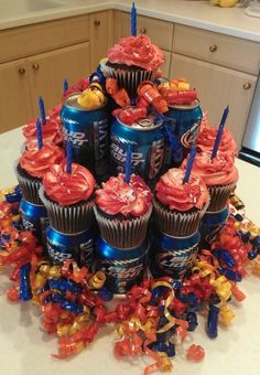 a cake made out of cupcakes and candy on top of a kitchen counter