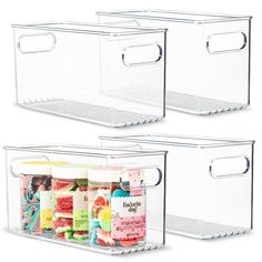 two clear storage bins with lids and handles on each side, one filled with candy