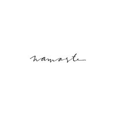 the word namast written in cursive writing on a white background with black ink