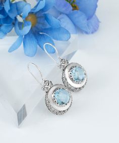 "Are you looking for a beautiful set of Sterling Silver Filigree Earrings? These Blue Topaz Drop Earrings are simply amazing. They are great for yourself or make an unforgettable gift. You will absolutely love the gorgeous design and they are sure to add some style to any outfit. This pair of earrings would make a perfect birthday or Christmas gift for that special lady in your life! The length is 1.55\" and the width is 0.75\" Blue Topaz gemstone is 10 mm, double side faceted, checkerboard roun Blue Earrings With Intricate Design For Gift, Ornate Gemstone Earrings For Gifts, Gemstone Drop Earrings, Stylish Earrings, Blue Topaz Gemstone, Blue Topaz Stone, Art Women, Filigree Earrings, Sterling Silver Filigree