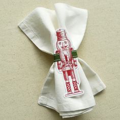 a white napkin with a red and green design on it